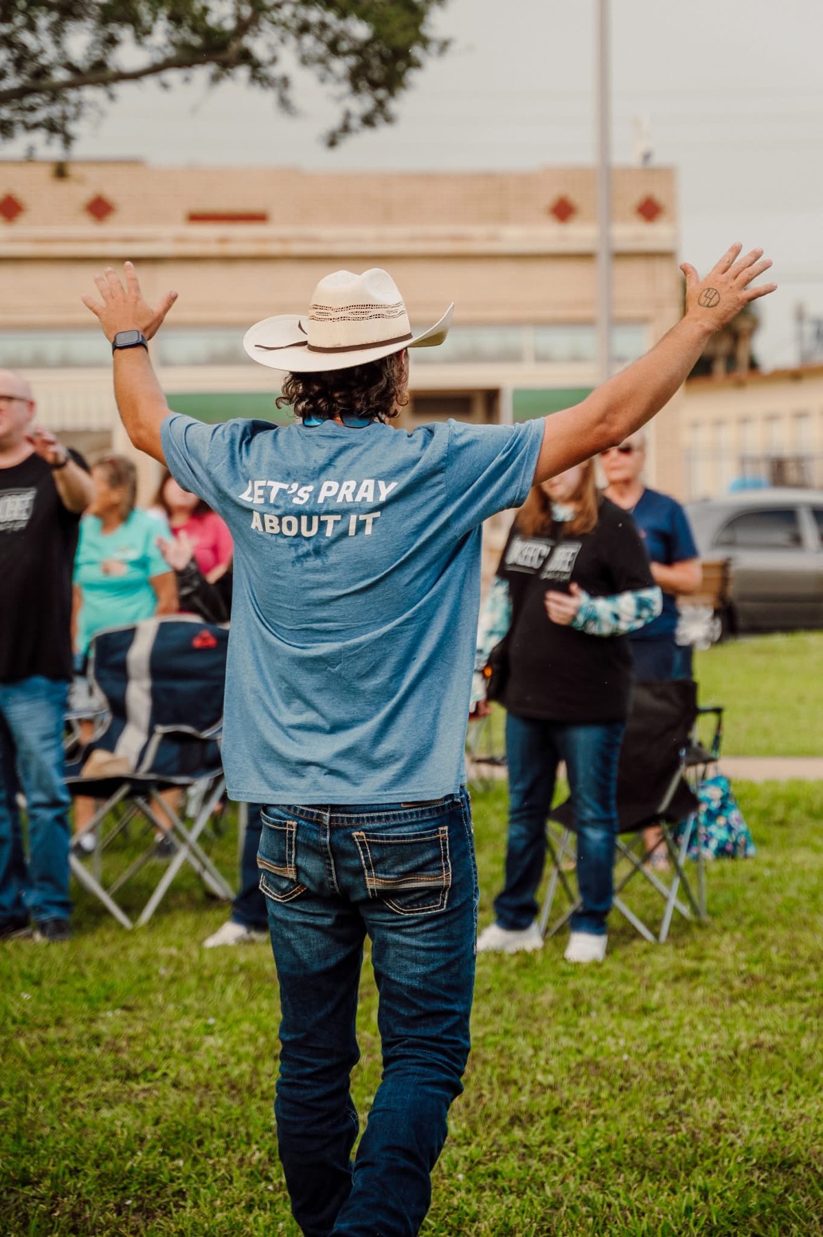 Let’s Pray About It Ministries leading community prayer outdoors